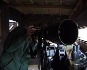 Birdwatchers with huge telephoto lens.