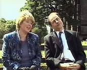 'Muriel' and 'Keith' on cemetery bench talking.