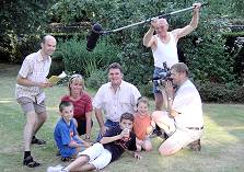 Actors and crew on the lawn.