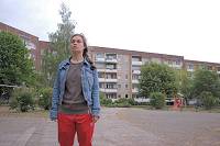 Elisabeth Heckel outside the prefab blocks of flats in 'Next Door'.