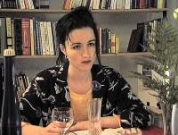 Still from 'Sublime' showing girl at romantic dinner.